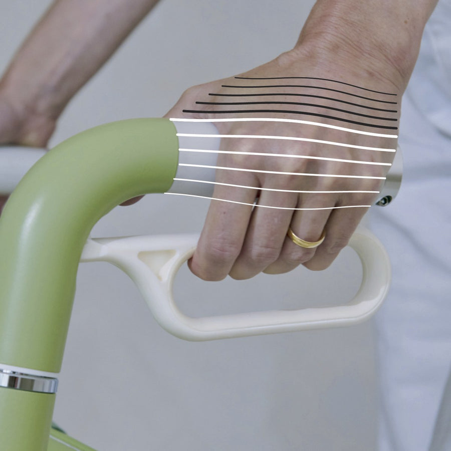 Hand resting on the arched Zeal handle